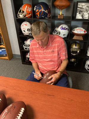 This eleven inch football not only shows your University of Florida Gator Pride with those traditional Orange & Blue colors, you can now own a ball signed by legendary Head Ball Coach, Steve Spurrier, while also supporting his culinary excellent restaurant ~ Spurrier's Gridiron Grille.