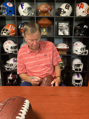 Would you like the Head Ball Coach Steve Spurrier to wish your diehard Gator fan a Happy Gator Birthday, give you a personalized pep talk or Congratulation you best friend on their big wedding day? You've found the right place to make it happen! It is  a Cameo with an Orange and Blue twist.      With purchase you will receive an email to further inform you on this process or email merch@spurriers.com for questions/comments/concerns.