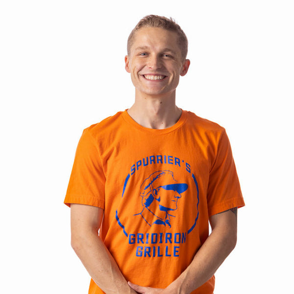 Much like the Steve Spurrier’s University of Florida Gator offenses got the attention of SEC defenses, this throwback T-shirt with Coach Spurrier’s profile and collegiate lettering is sure to grab the attention too.  Available in Navy & Orange